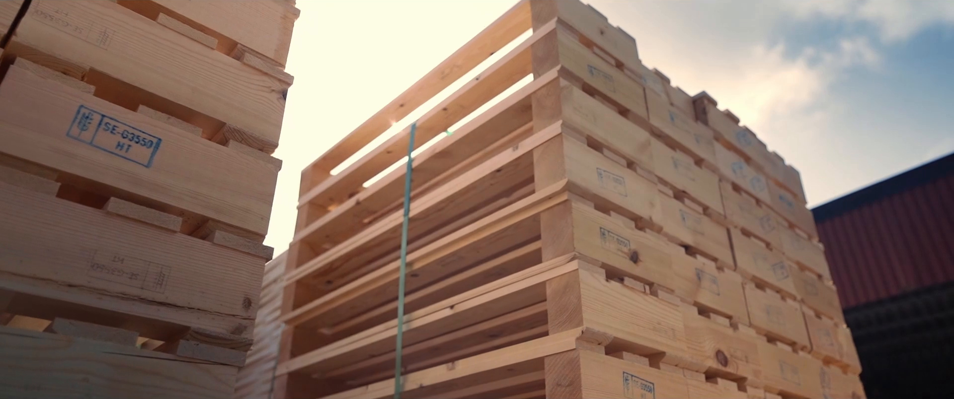 Stacks of newly manufactured wooden pallets.