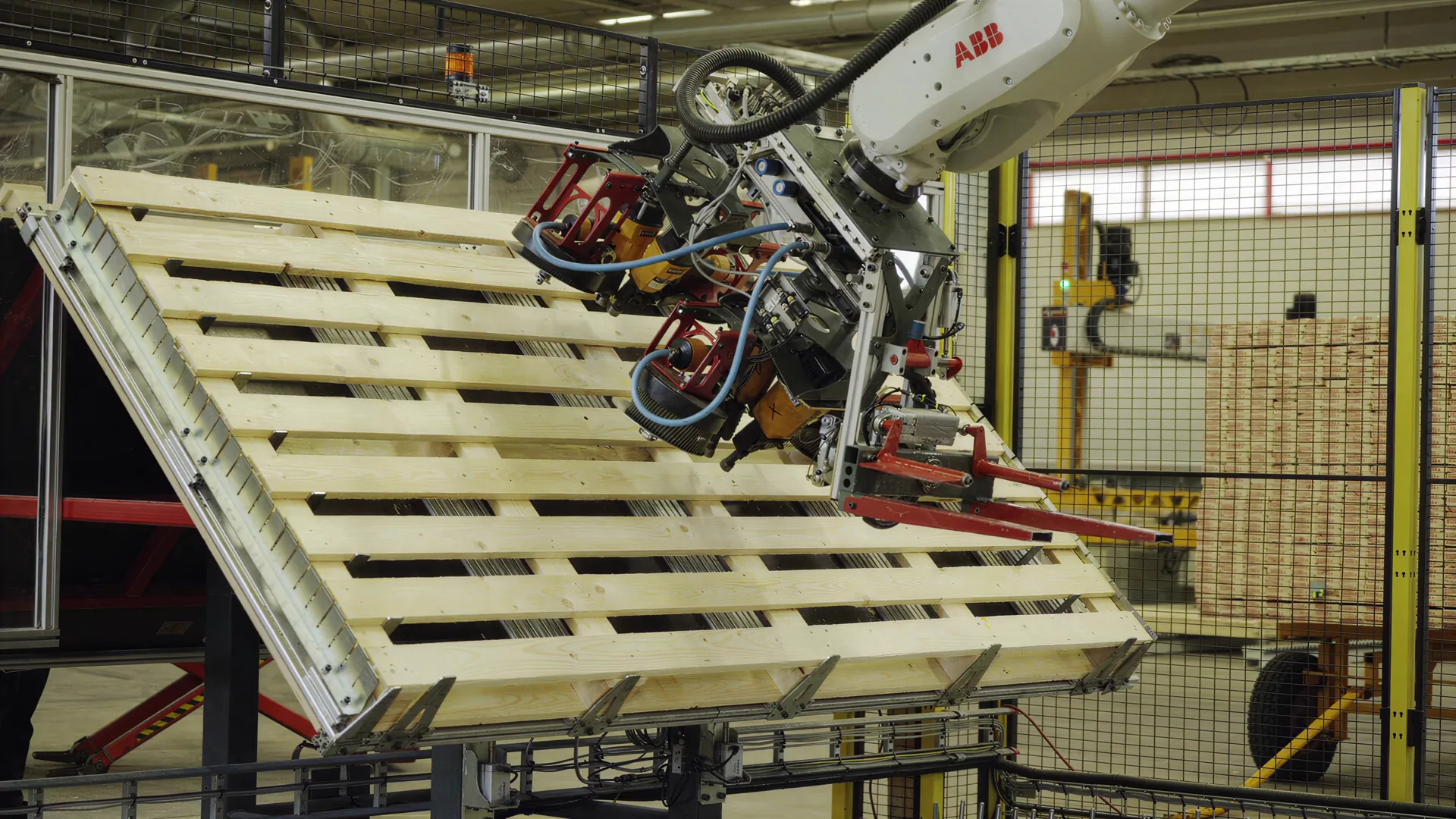 Robotic cell with a wooden pallet at GLF's production facility in Genarp.